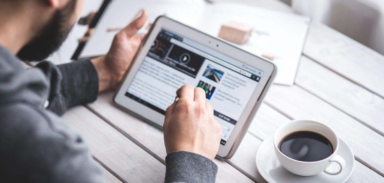 worker-reading-news-with-tablet